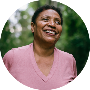 Woman in pink shirt smiling