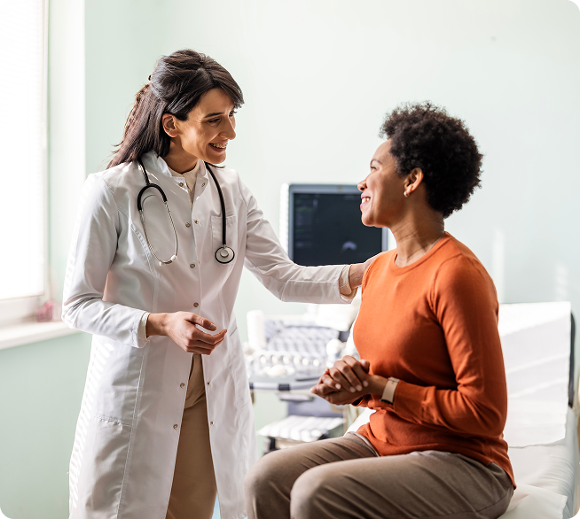 Health care provider and patient in an exam room