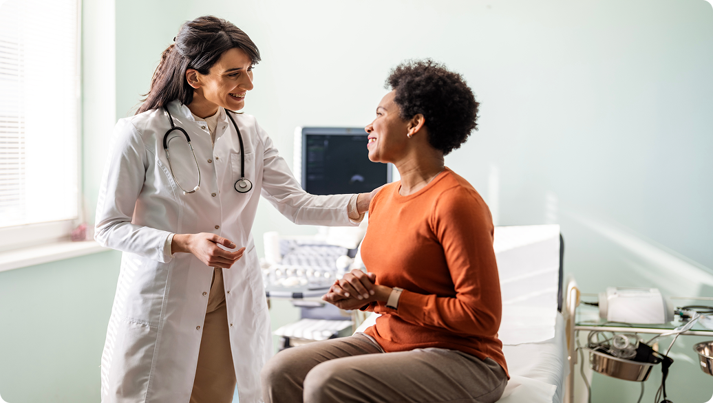 Health care provider and patient in an exam room